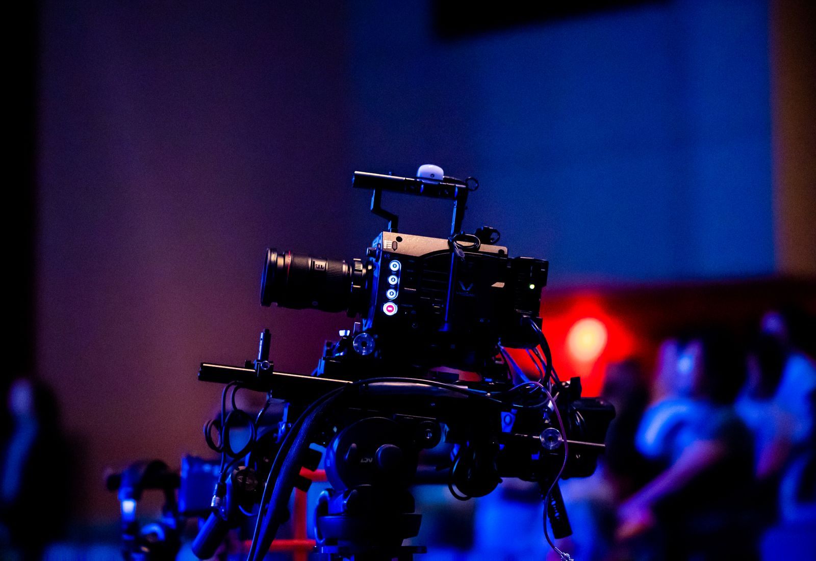 Broadcast camera filming a live studio audience for a TV show